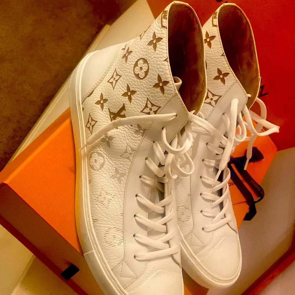 Louis Vuitton sneakers with the LV design on the shoe